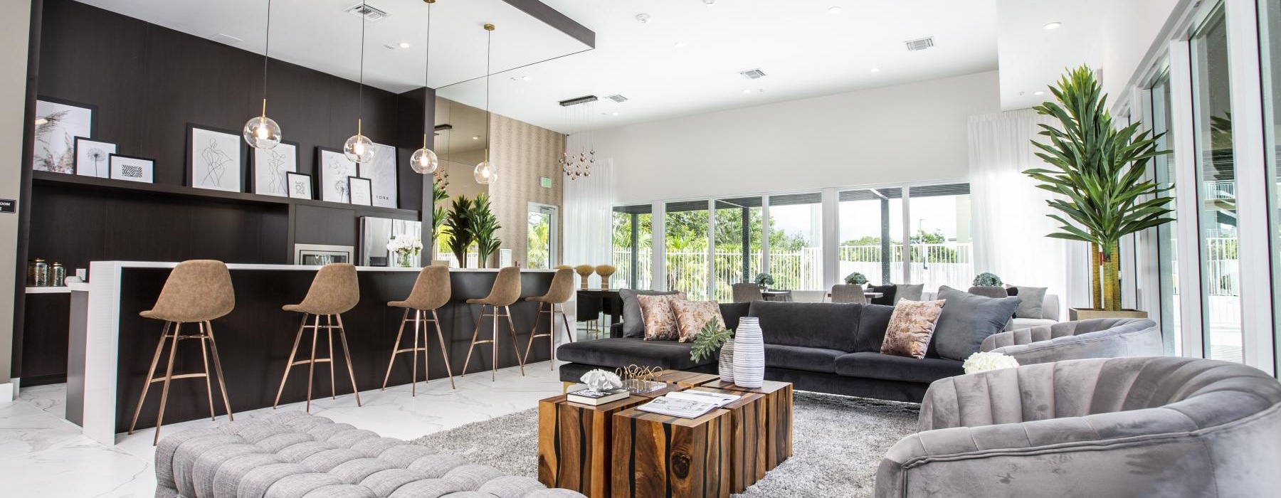 a spacious room with a large chandelier and a couch