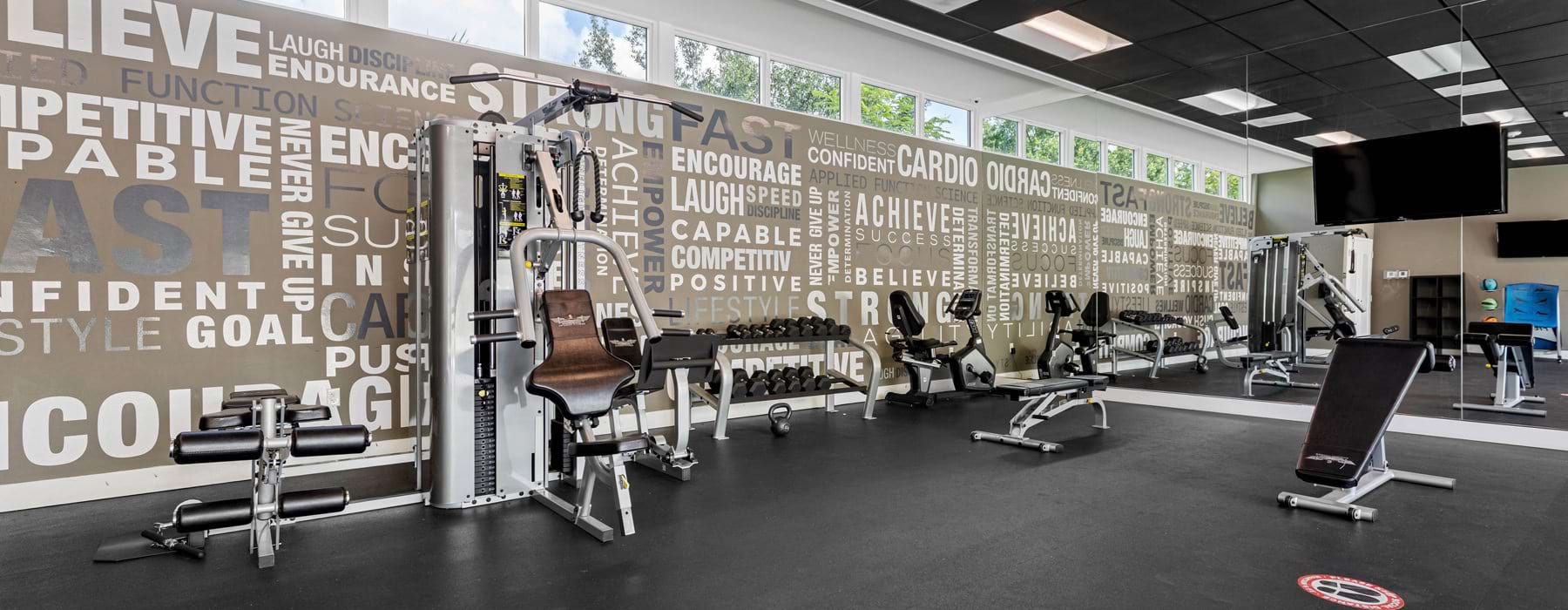 fitness center with exercise equipment
