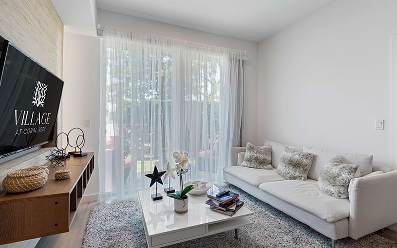 living room with couch coffee table and white walls