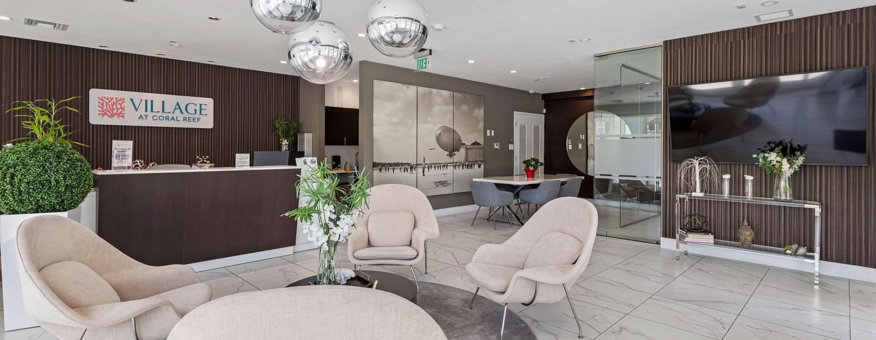 lobby with desk chairs and coffee table